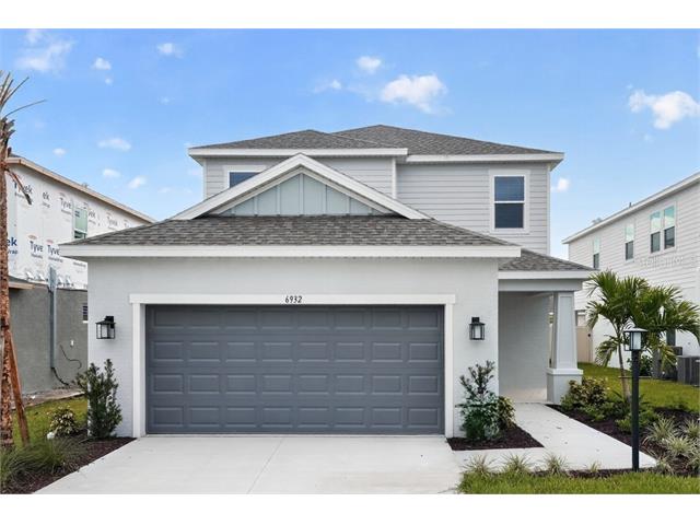 Front exterior of the Anastasia, a two-story Taylor Morrison home with a two-car garage at Tiburon in Nokomis, Florida